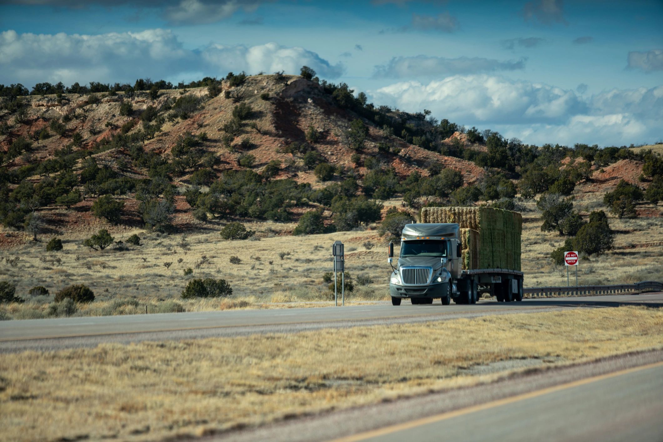 Flatbed truck hauling cargo on highway